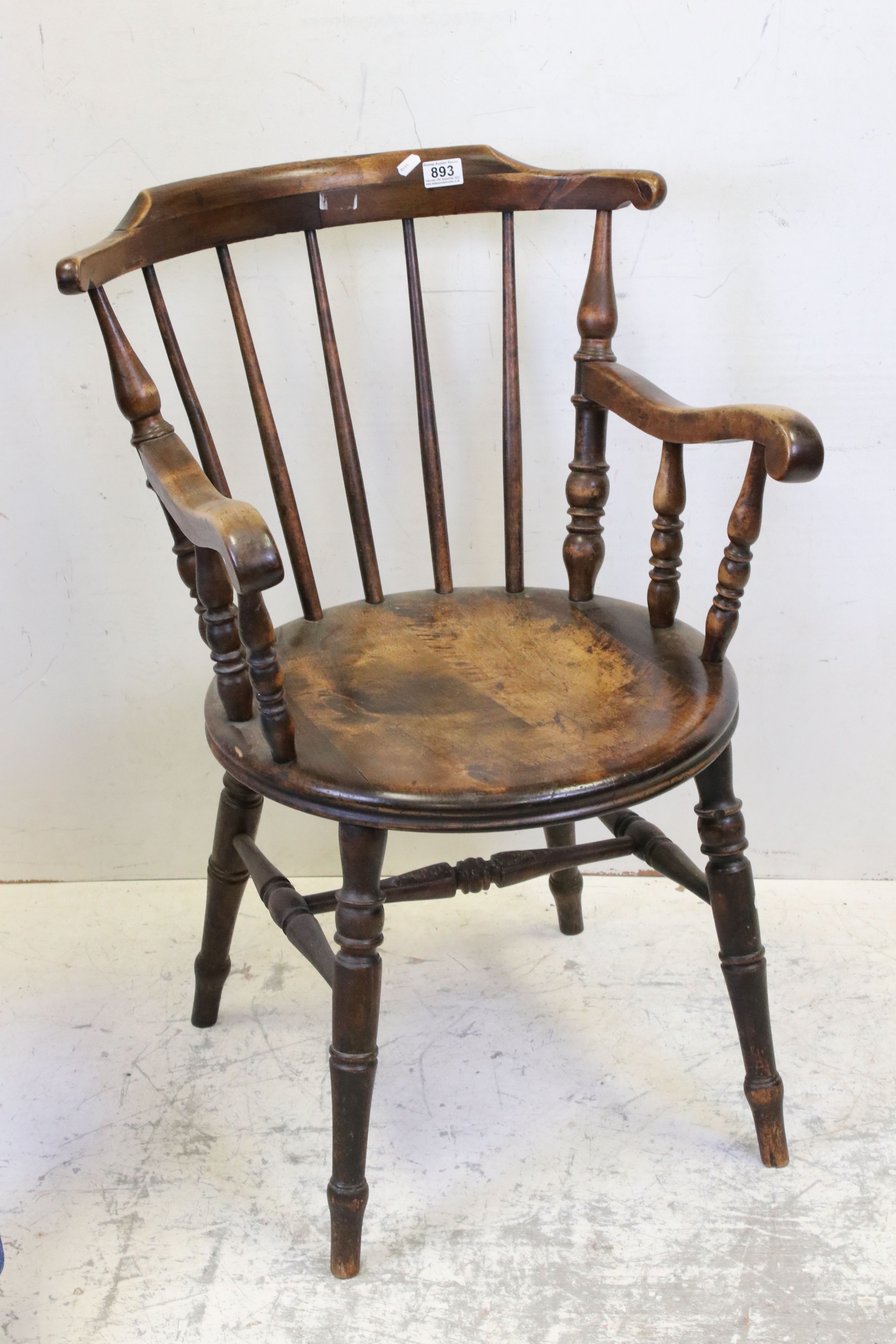 Early 20th century Stickback Elbow Chair with solid circular seat, 88cms high