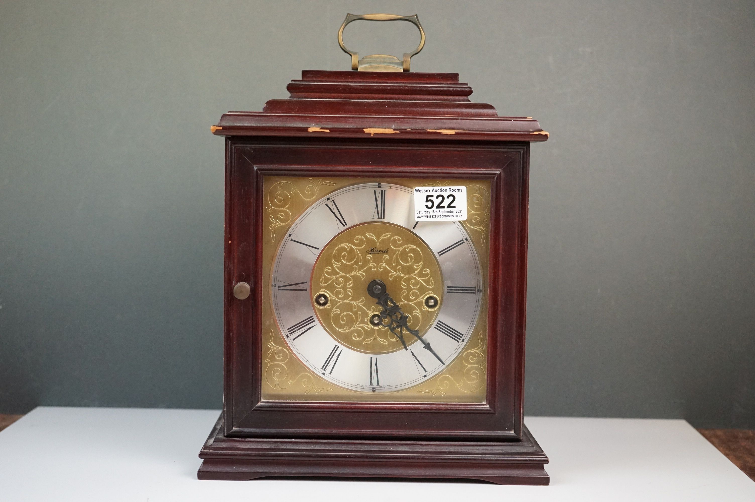 A vintage German wooden cased chiming mantle clock.