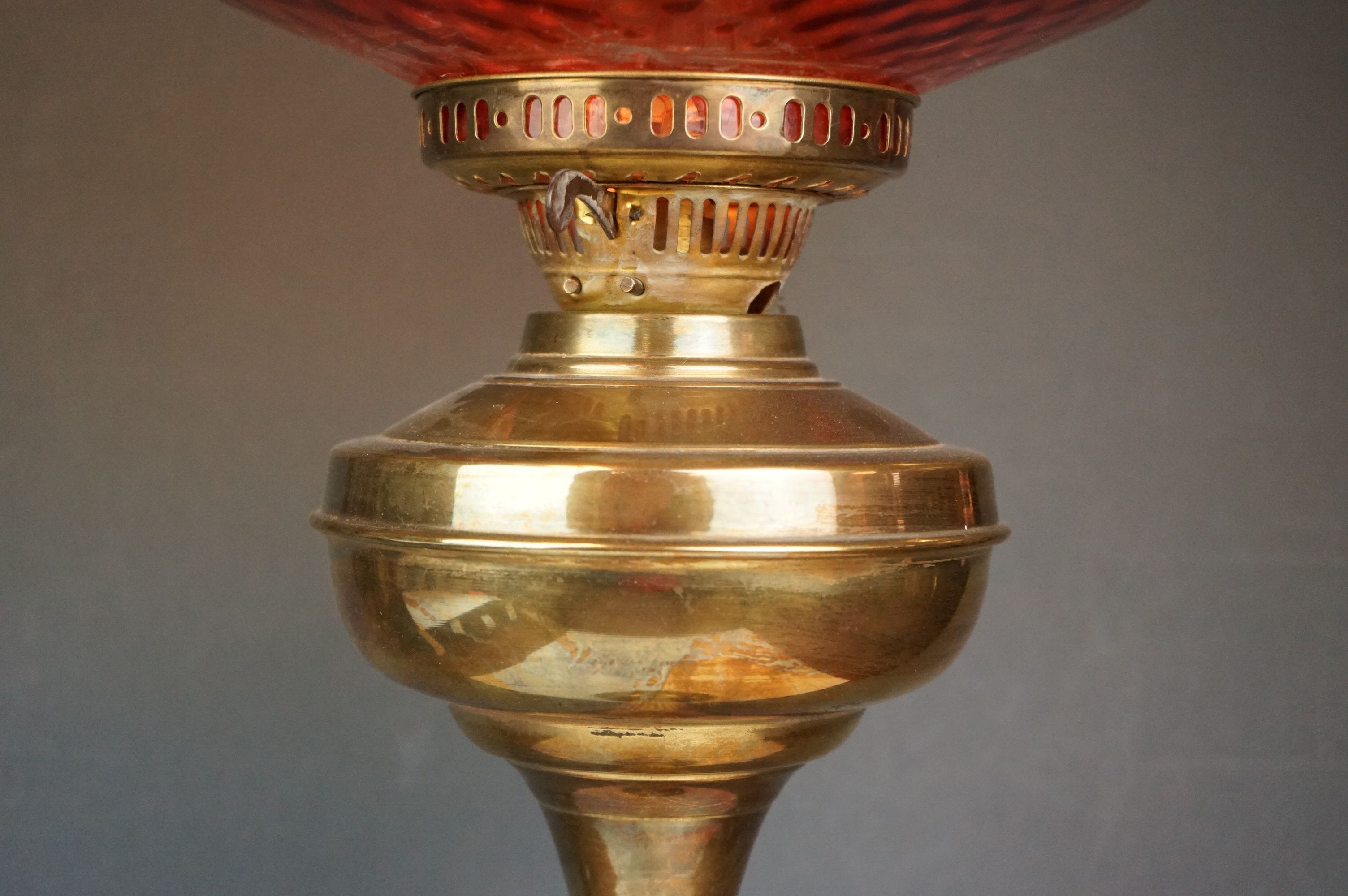 A vintage brass oil lamp with orange glass shade converted to electric. - Image 4 of 4