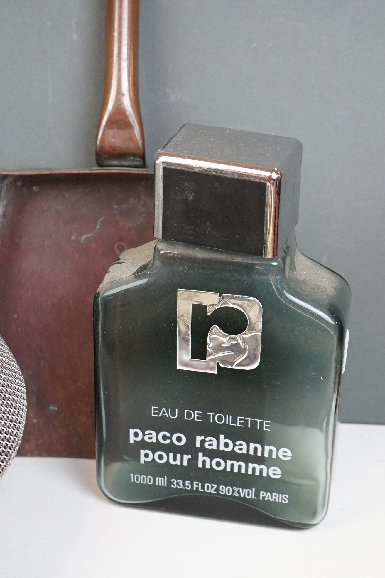 A box of mixed collectables to include a fencing mask, an oversized Paco Rabanne scent bottle and - Image 6 of 6