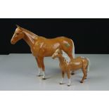 Two Beswick Horses including Palomino Head Up Pony (no. 1197) and Palomino ' Imperial ' (no. 1557)