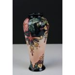 Moorcroft Vase in the Oberon pattern, impressed pink marks to base and signed WM, 21cms high