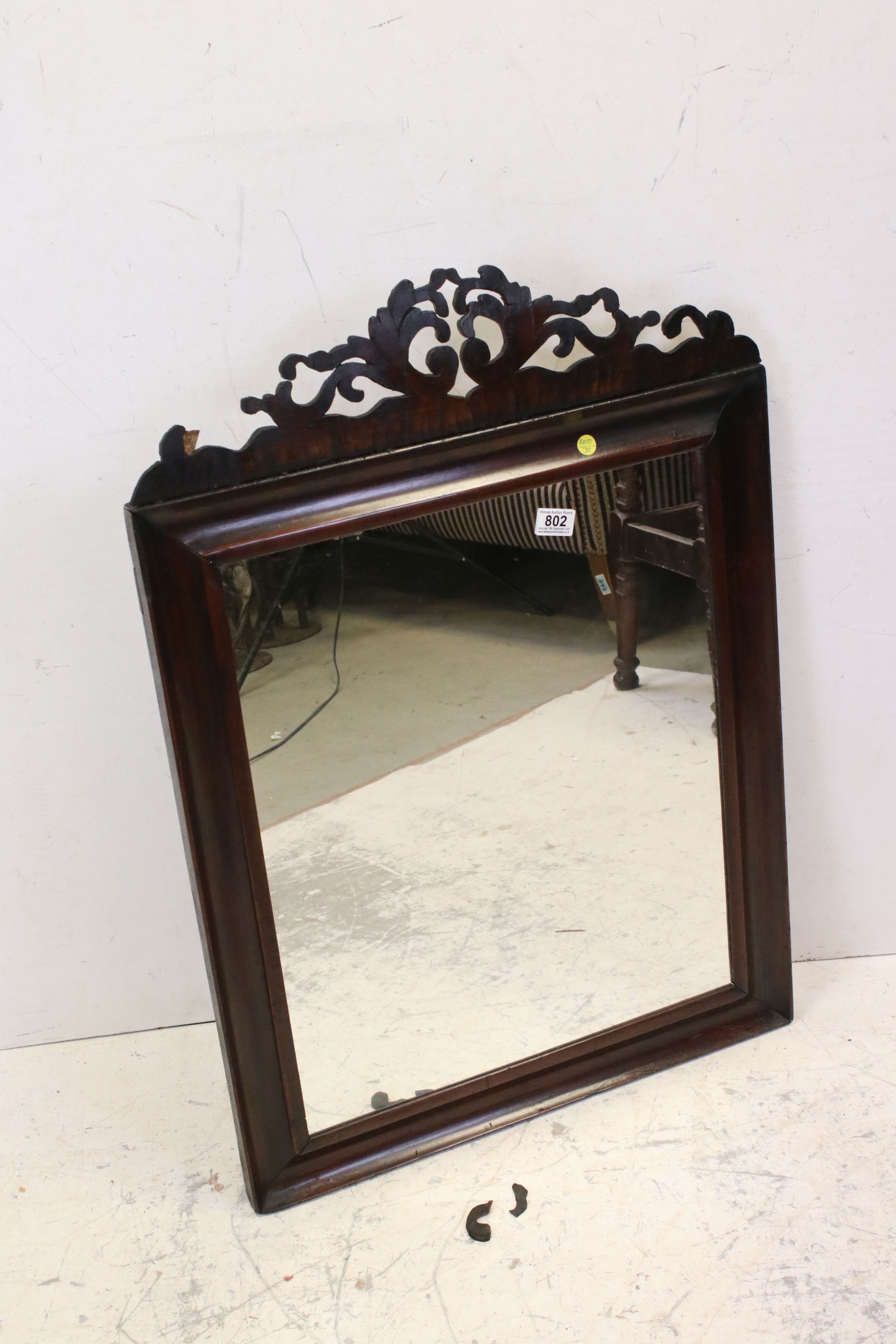 Antique mahogany wall mirror with fretwork top