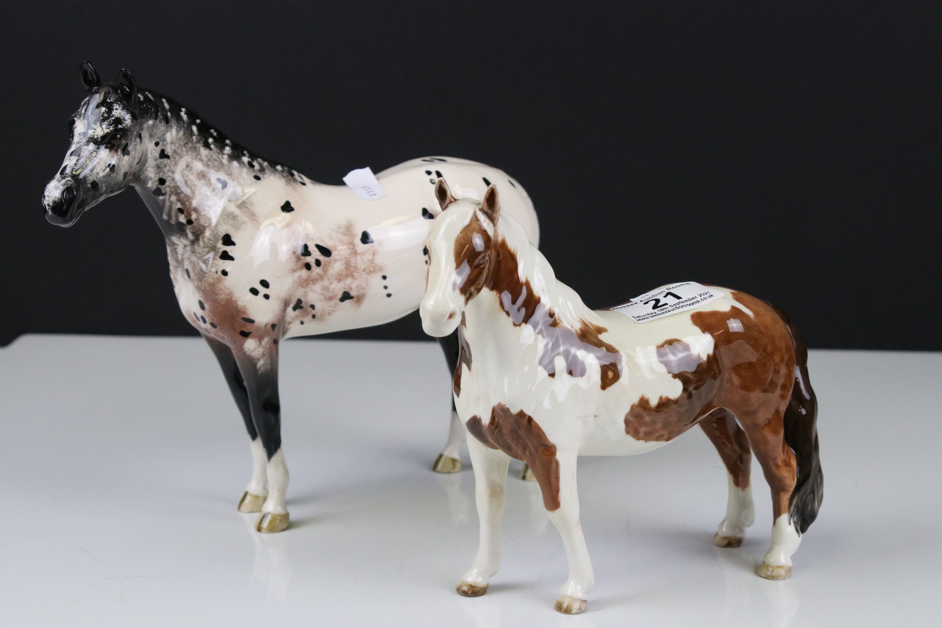 Beswick Skewbald Pinto Pony (first version) (no. 1373) together with a Beswick Appaloosa Stallion (