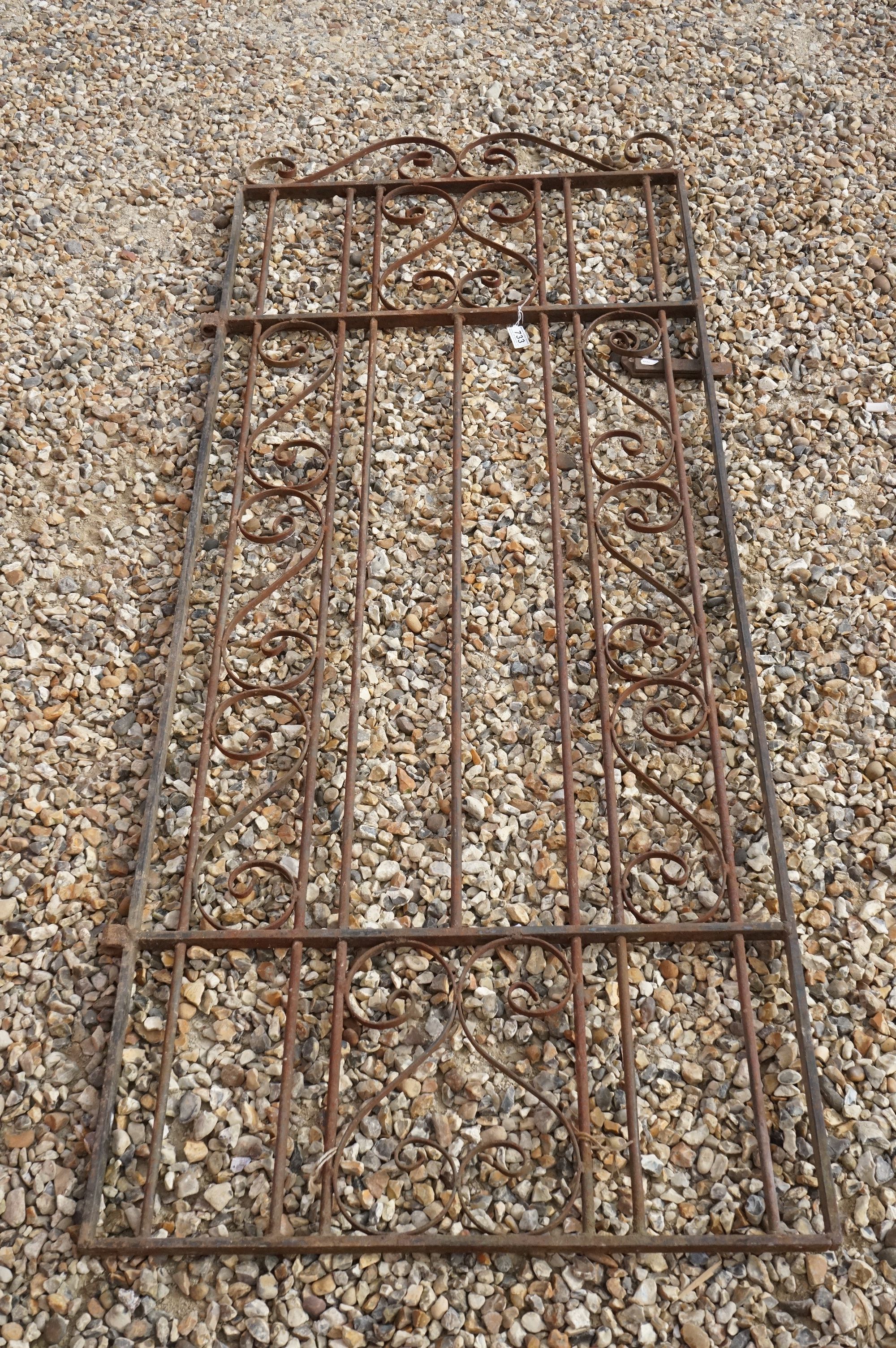 A vintage wrought iron Garden gate.