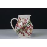 Moorcroft Jug in the Frangipani Plumeria pattern on a white ground, 15cms high