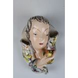 Early 20th century Goldscheider Wall Pocket in the form of a Lady holding an Apple, 19cms high