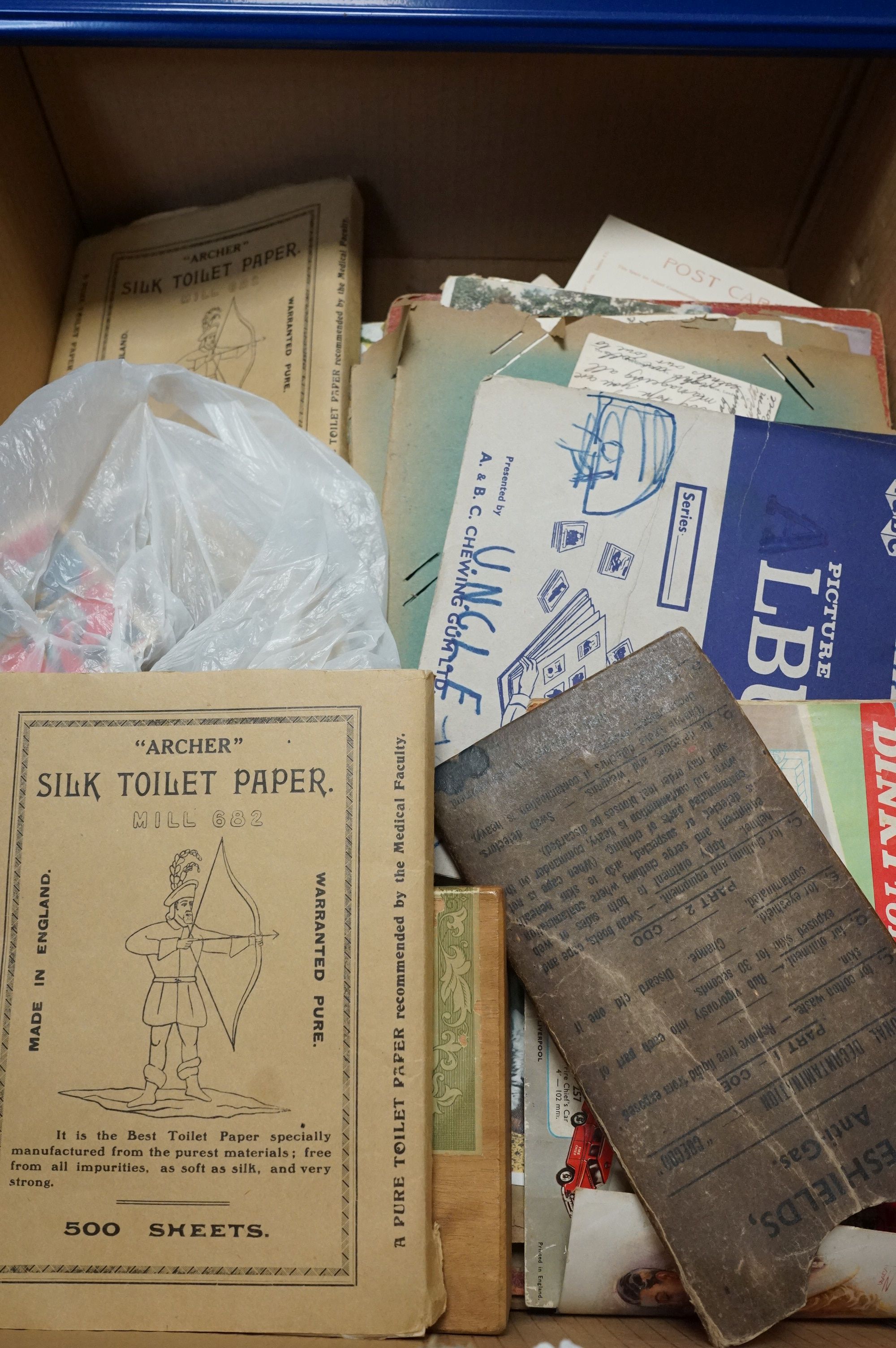 A collection of mixed ephemera to include sweet & bubble gum cards, postcards and antique toilet