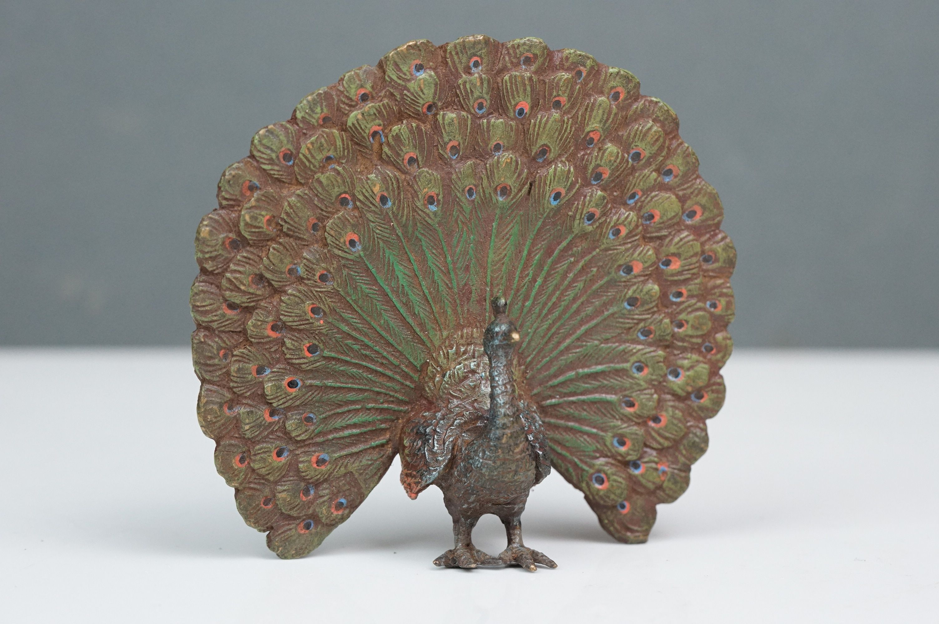 Cold painted bronze figure of a peacock with extended feathers