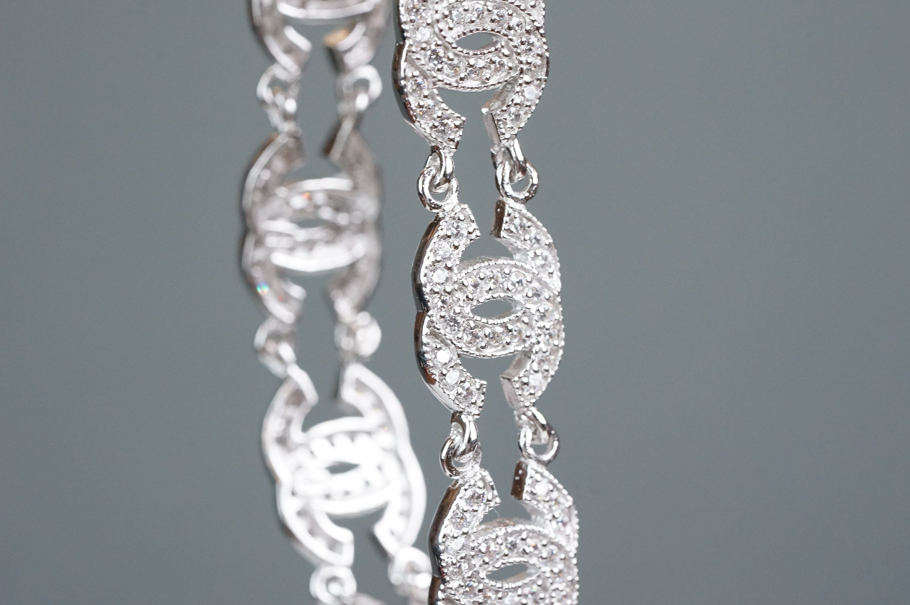 Silver and CZ set bracelet, in the Chanel style, set with eight double C links - Image 4 of 6