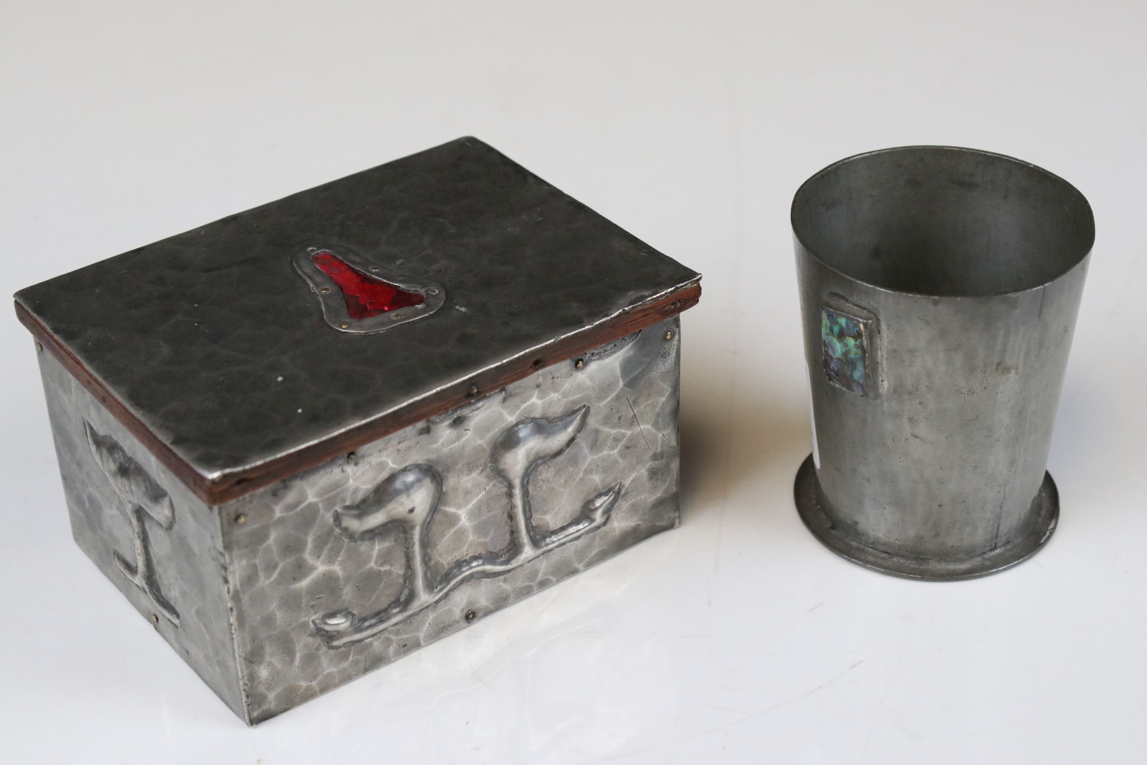 Arts and Crafts Hammered Pewter covered Box decorated in relief with stylised foliage, the lift