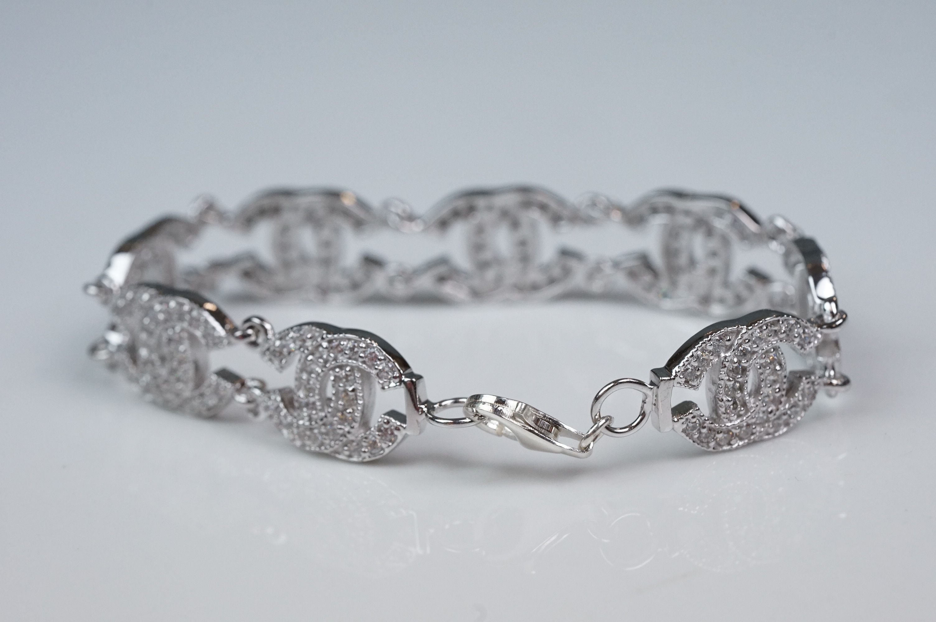 Silver and CZ set bracelet, in the Chanel style, set with eight double C links - Image 2 of 6