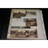 A large collection of vintage postcards contained within an album to include real photograph and