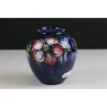 Moorcroft Vase in the Clematis pattern on a blue / green ground, marked to base an impressed