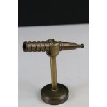 Novelty paperweight in the form of a telescope