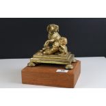 Gilt Bronze Group of a Dog protecting a sleeping child, possibly French 19th century, 16cms high,