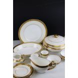 A Minton bone china part dinner / tea service to include cups, saucers, tureens, plates, gravy