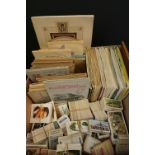 A large collection of of vintage cigarette and tea cards to include loose and album mounted