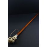 Walking Stick, the handle in the form of a Skull with red eyes, 83cms long
