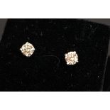 Pair of 14ct white gold diamond stud earrings, of 65 points total