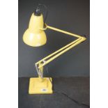 A vintage Herbert Terry two step angle poise yellow table lamp.