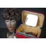 A Mannequin head for displaying jewellery, wigs or hats together with a red Echolac vanity case