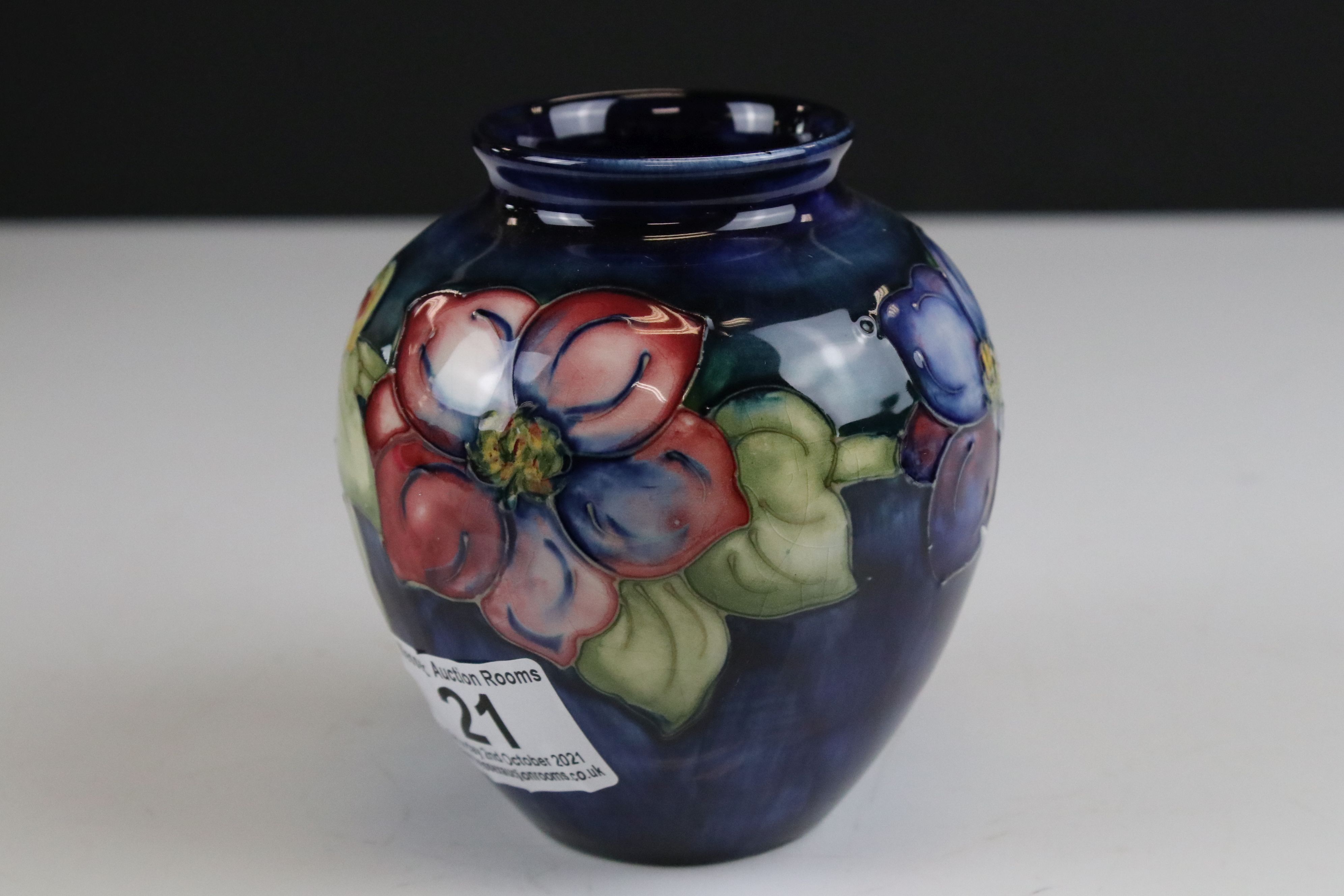 Moorcroft Vase in the Clematis pattern on a blue / green ground, marked to base an impressed - Image 5 of 8