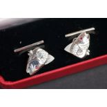 Pair of silver fish cufflinks, with ruby eyes
