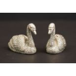 Pair of silver plated condiments of swan form, with ruby eyes