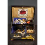 A vintage lacquer ware jewellery box together with a small quantity of vintage costume jewellery.