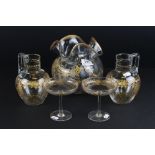 Pair of Late 19th / Early 20th century Glass Jugs with etched gold coloured decoration of floral