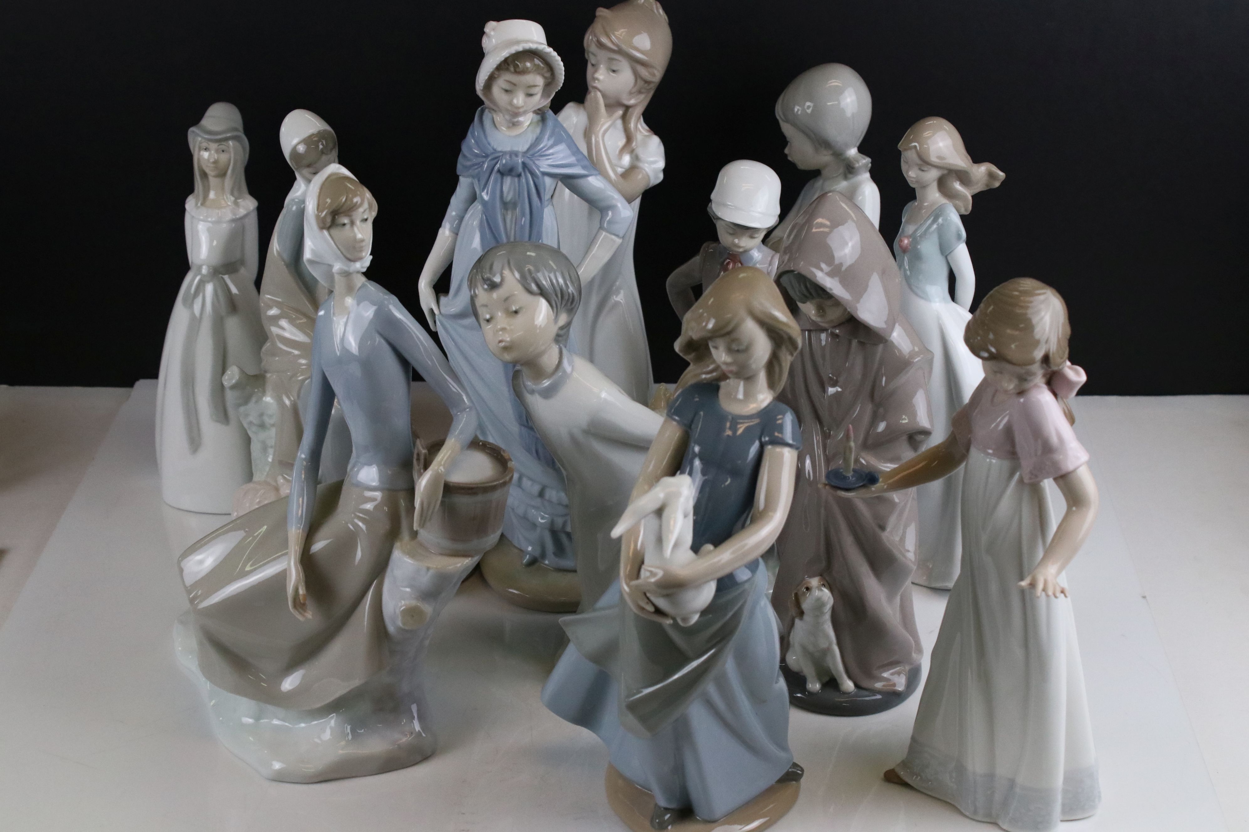 Collection of Twelve Nao Figurines