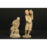 Two Japanese carved ivory Okimono figures of a fisherman and a fruit seller.