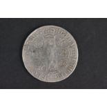 A British Queen Anne Full Crown coin dated 1707.