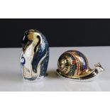 Two Royal Crown Derby Ceramic Paperweights - Penguin and Chick (gold stopper) and Garden Snail (