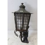 Wrought Iron Wall Mounted Lantern on scrolling bracket, 72cms high