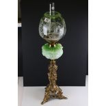 Late 19th / Early 20th century Oil Lamp with green embossed glass font, tall ornate brass base and