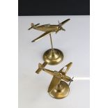 Two Brass Models on Stands of a Stuka Plane and a Spitfire, 22cms high together with an Oval