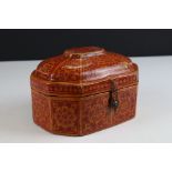 Indian Painted Papier Mache Lidded Box decorated with orange flowers on a red ground, 18cms long