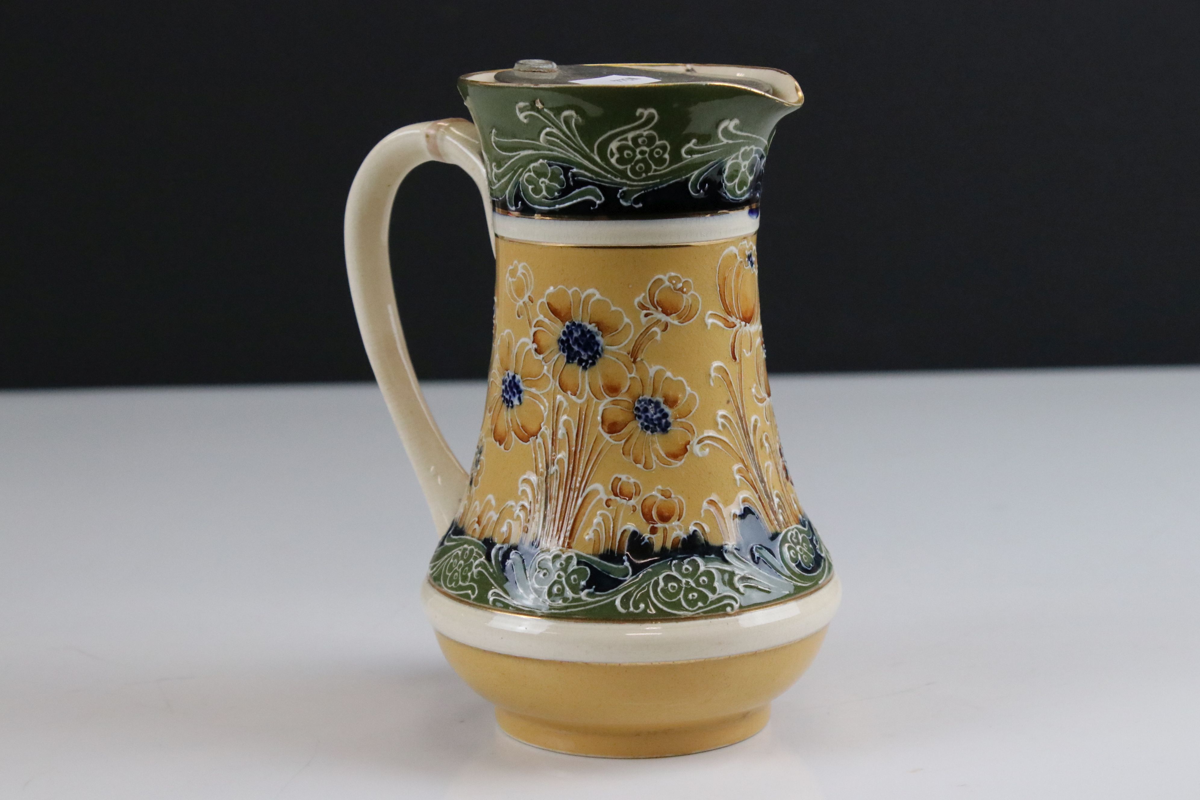 Late 19th / Early 20th century James Macintyre ' Gesso Faience ' Water Jug with pewter lid decorated