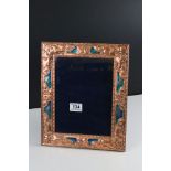 Large and unusual copper and enamel easel back picture frame