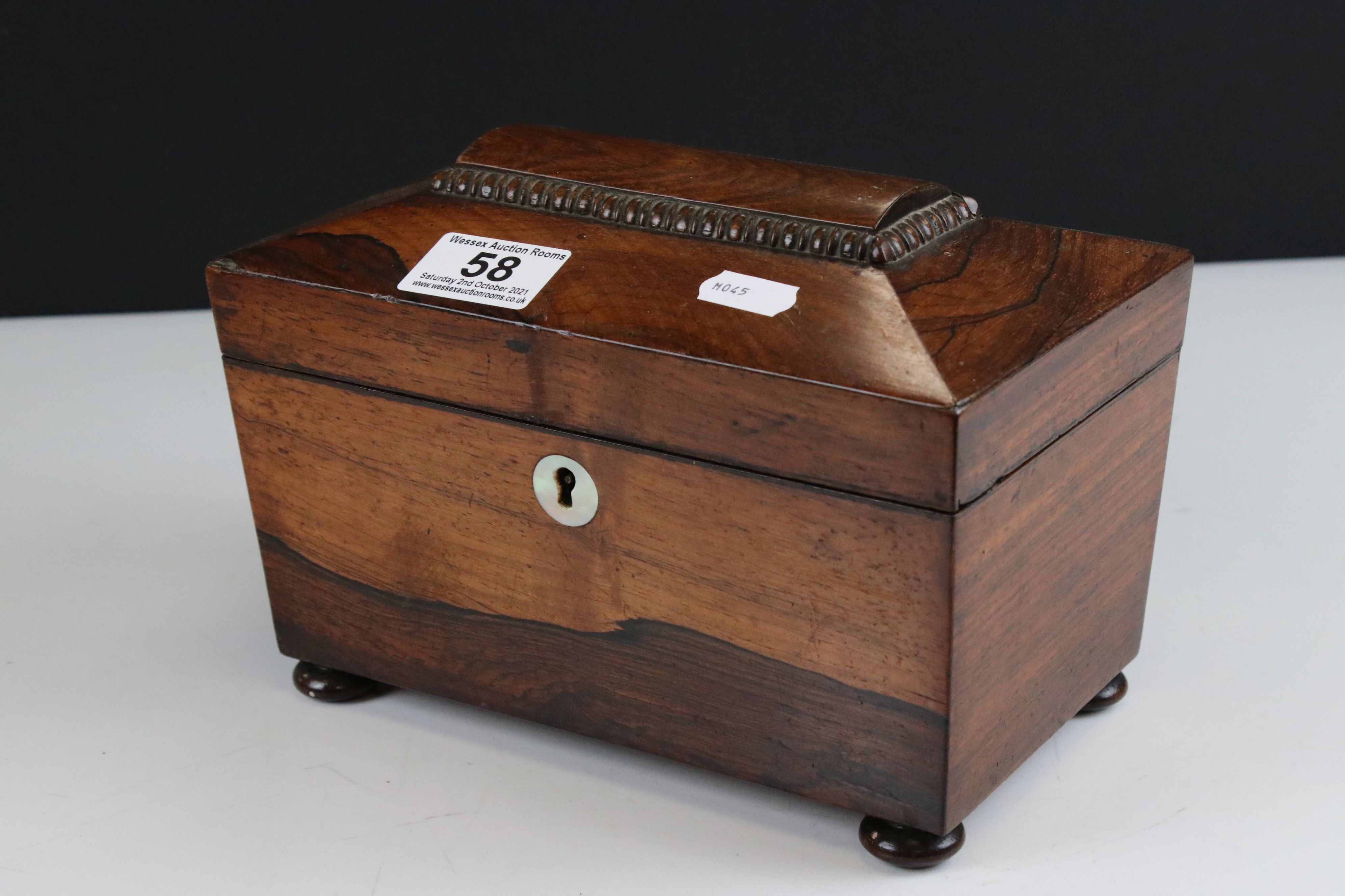 Georgian Rosewood Tea Caddy of sarcophagus form, the hinged lid opening to two lidded