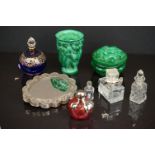 A small collection of vintage scent bottles and dressing table jars.