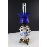 Late 19th / Early 20th century Hinks Oil Lamp, the cream ceramic drop in font decorated with blue