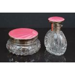 Two cut glass dressing table jars with fully hallmarked sterling silver lids with pink guilloche