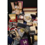 A large collection of mainly vintage costume jewellery to include silver examples and a musical