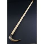 Japanese style Walking Stick, the shaft formed from resin bone effect carved panels depicting