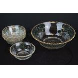 A 1930's gilded glass fruit salad bowl with six matching dishes decorated with stylised raised fruit