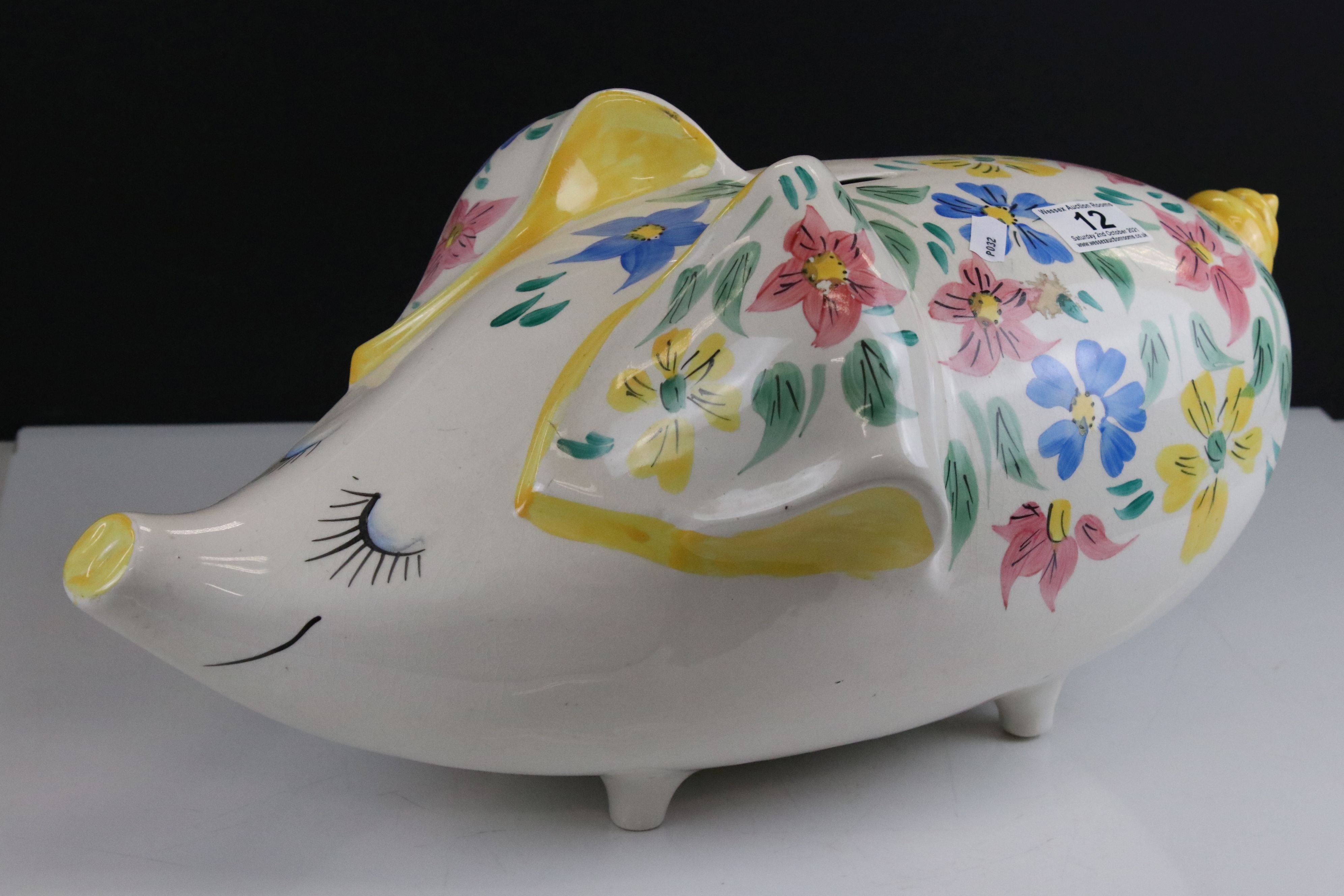 Large Arthur Wood Ceramic Pig Moneybox decorated with pink, blue and yellow flowers, 49cms long