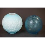 A turquoise floral etched round oil lamp shade together with a large round opaque turquoise oil lamp
